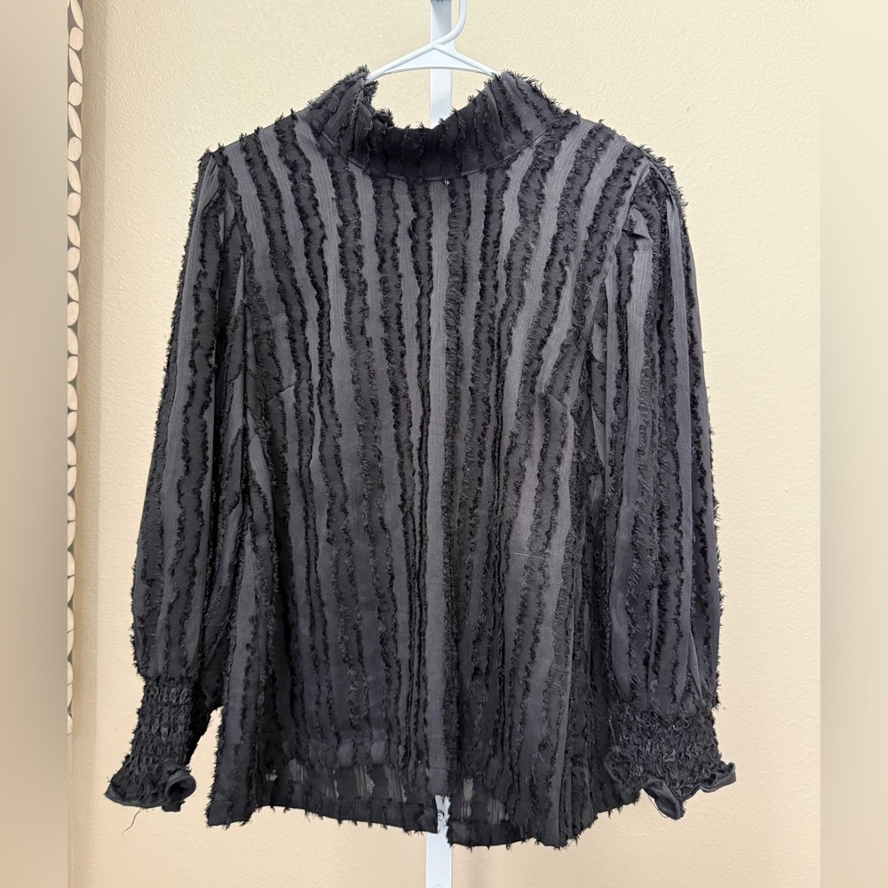 Buru long sleeve mod top in black fringe. Size small.
